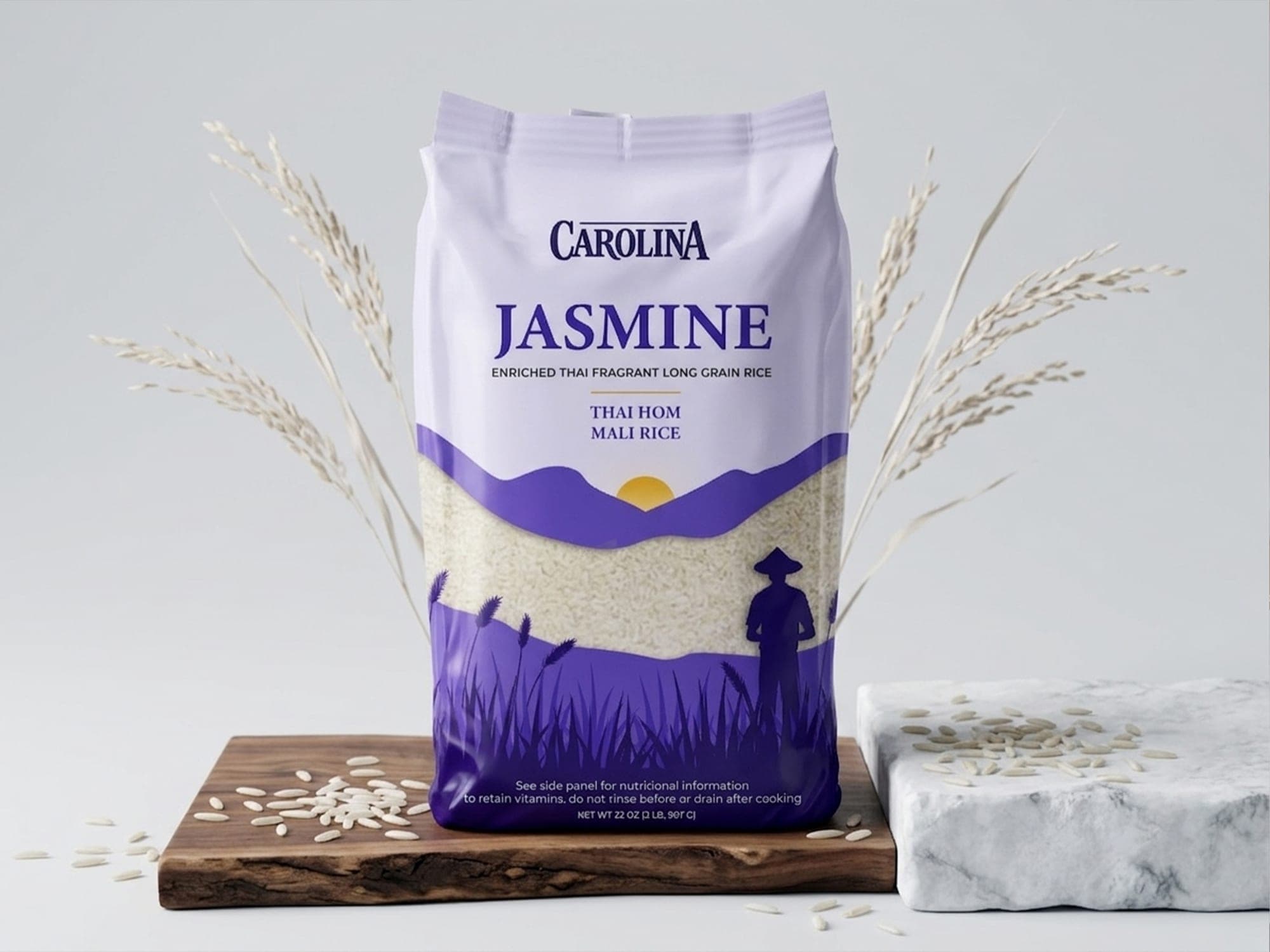Carolina Jasmine Rice pouch on a wooden board with dried rice stalks and scattered grains