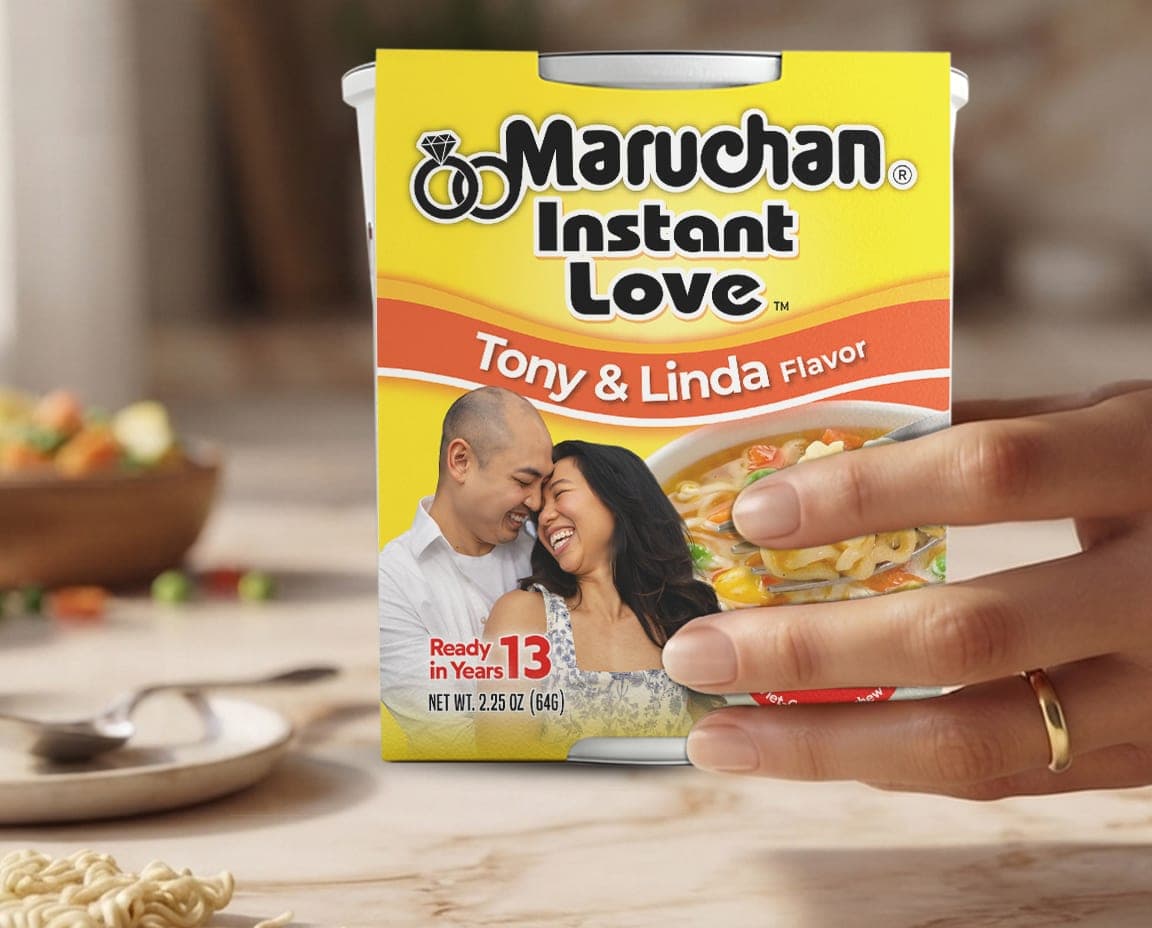The Instant Love cup on a marble counter beside a velvet ring box and dried lavender